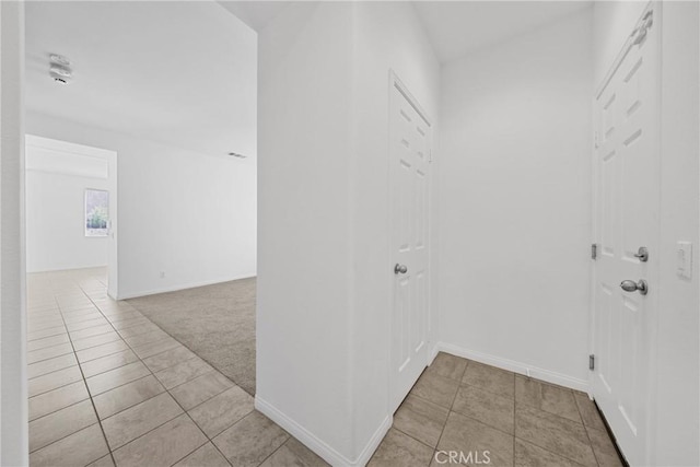 34135 Crenshaw St, Beaumont, CA 92223 - corridor with light tile patterned flooring and light colored carpet