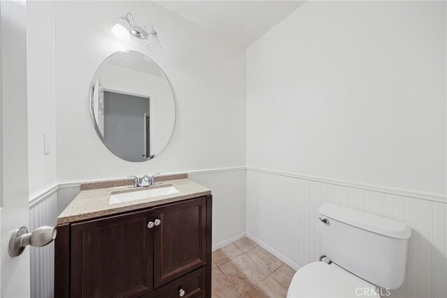 34135 Crenshaw St, Beaumont, CA 92223 - bathroom with wainscoting, vanity, and tile patterned floors
