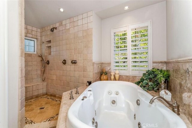 25908 Coleridge Pl, Stevenson Ranch, CA 91381 - full bathroom featuring tile walls, tiled shower, tile patterned floors, recessed lighting, and a jetted tub