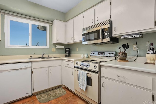 4428 Skimmer Way, Oceanside, CA 92057 - kitchen featuring white appliances, a sink, white cabinets, and light countertops