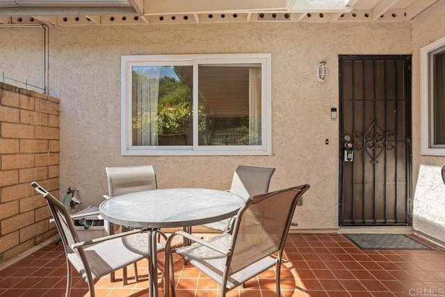 4428 Skimmer Way, Oceanside, CA 92057 - entrance to property featuring stucco siding, a patio, and outdoor dining area
