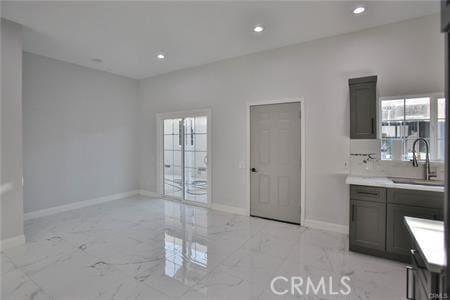 1226212266 Madras Pl, Garden Grove, CA 92840 - kitchen featuring a sink, light marble finish floors, recessed lighting, baseboards, and light countertops