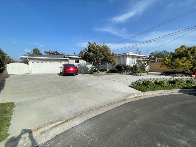 view of front of property with fence and a gate