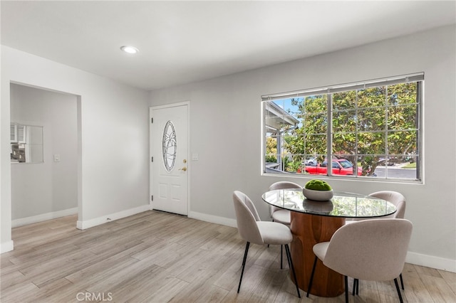 dining area with recessed lighting, baseboards, and light wood-type flooring