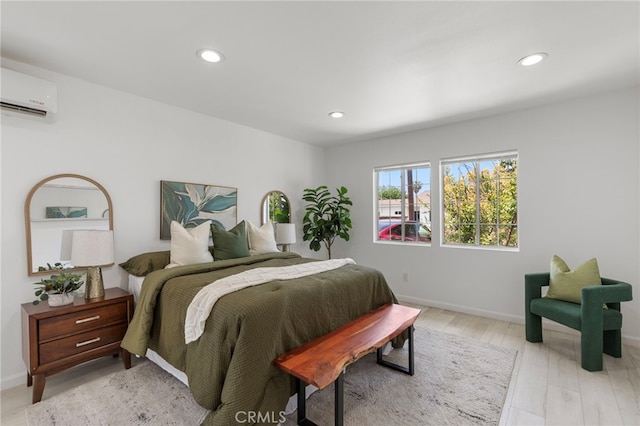 1226212266 Madras Pl, Garden Grove, CA 92840 - bedroom featuring recessed lighting, a wall mounted air conditioner, baseboards, and light wood finished floors