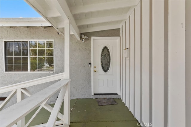 view of exterior entry with stucco siding