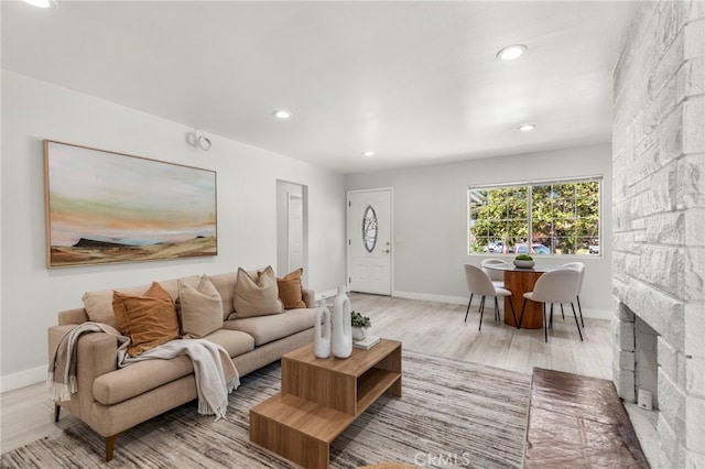 1226212266 Madras Pl, Garden Grove, CA 92840 - living room featuring light wood-type flooring, recessed lighting, and baseboards