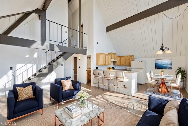 743 Rhine Rd, Lake Arrowhead, CA 92352 - living room featuring lofted ceiling with beams, stairway, and light wood finished floors