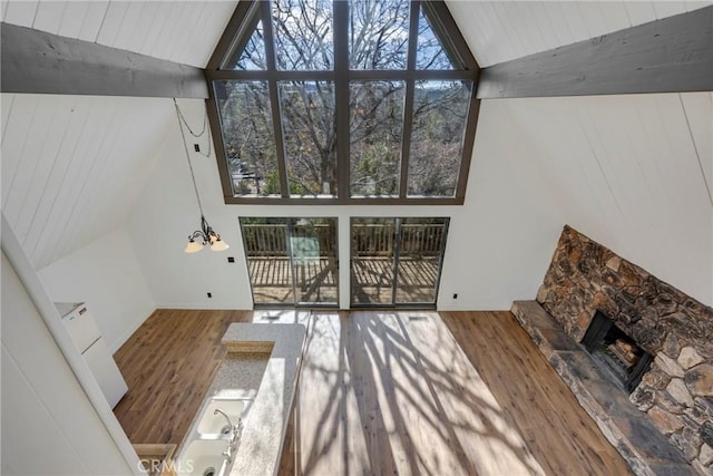 743 Rhine Rd, Lake Arrowhead, CA 92352 - living area featuring wood ceiling, a stone fireplace, high vaulted ceiling, and wood finished floors