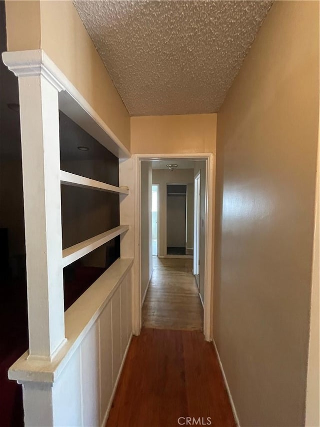3509 Greenglade Ave, Pico Rivera, CA 90660 - hall with wood finished floors and a textured ceiling