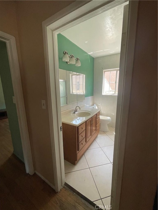 3509 Greenglade Ave, Pico Rivera, CA 90660 - bathroom featuring vanity, toilet, and wood finished floors