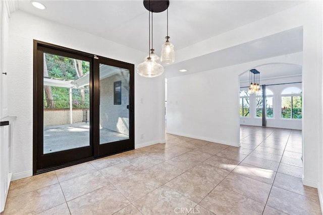 604 Avenida Acapulco, San Clemente, CA 92672 - unfurnished dining area with light tile patterned floors, baseboards, recessed lighting, a chandelier, and arched walkways