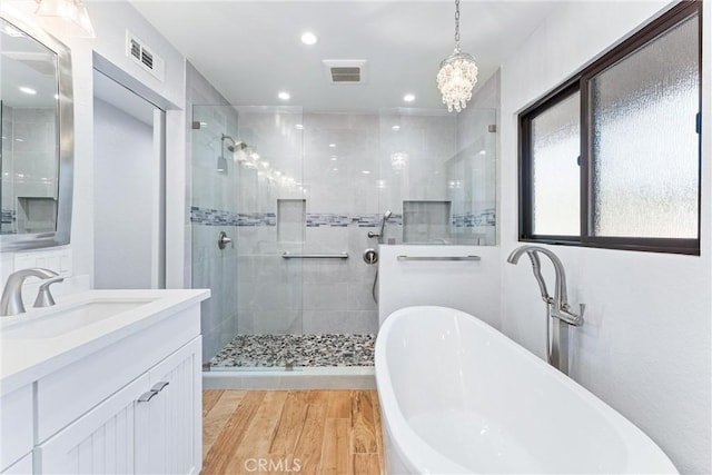 604 Avenida Acapulco, San Clemente, CA 92672 - full bathroom featuring a freestanding bath, a tile shower, vanity, wood finished floors, and recessed lighting