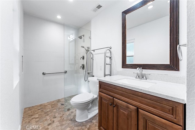 full bathroom featuring a walk in shower, vanity, toilet, recessed lighting, and visible vents