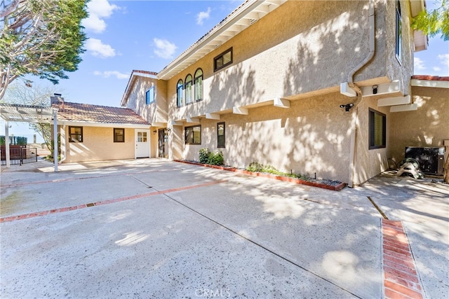 604 Avenida Acapulco, San Clemente, CA 92672 - rear view of property with stucco siding, a pergola, and a patio area