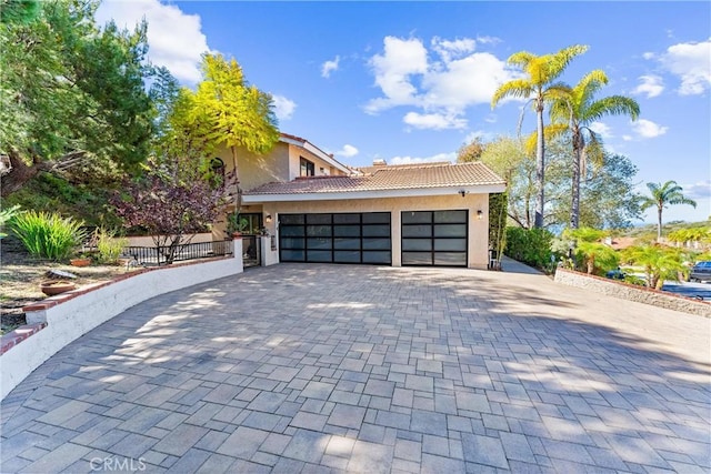 604 Avenida Acapulco, San Clemente, CA 92672 - view of front of house featuring stucco siding, an attached garage, decorative driveway, and a tiled roof