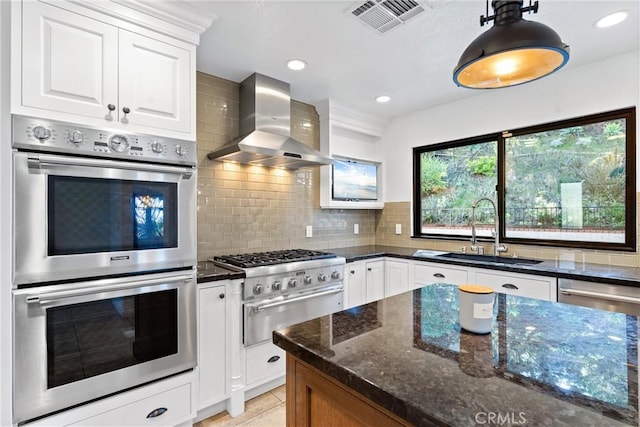 604 Avenida Acapulco, San Clemente, CA 92672 - kitchen featuring wall chimney exhaust hood, stainless steel double oven, a sink, dark stone countertops, and recessed lighting