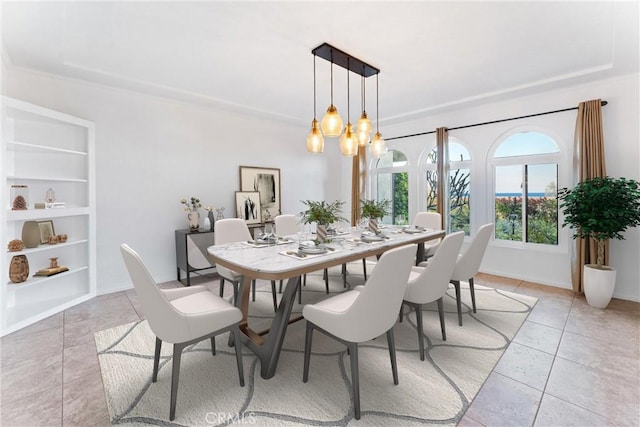 dining area with baseboards, an inviting chandelier, built in shelves, and light tile patterned floors
