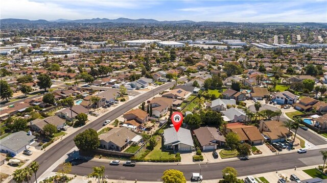 birds eye view of property featuring a residential view and a mountain view