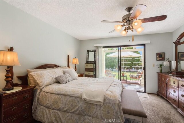 bedroom with access to outside, a textured ceiling, ceiling fan, and light colored carpet