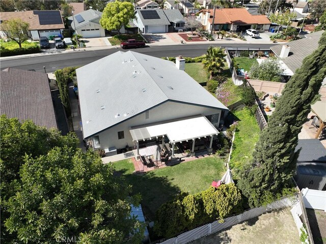 birds eye view of property with a residential view