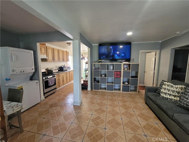 7132 Dinwiddie St, Downey, CA 90241 - living area with light tile patterned floors and stacked washer / drying machine