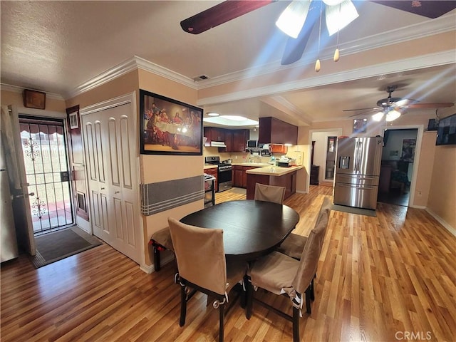 7132 Dinwiddie St, Downey, CA 90241 - dining area featuring visible vents, light wood-style floors, ceiling fan, and crown molding