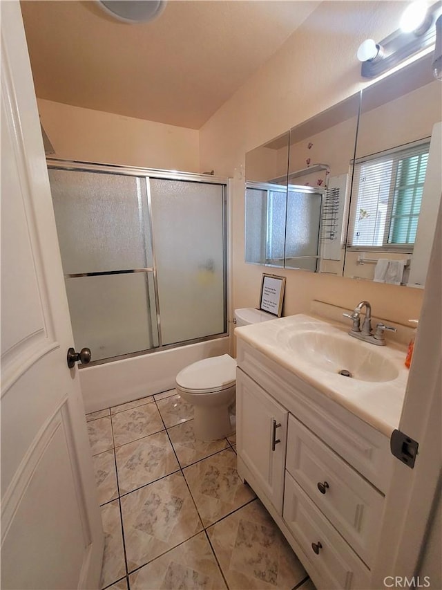 7132 Dinwiddie St, Downey, CA 90241 - full bath with vanity, toilet, tile patterned flooring, and shower / bath combination with glass door