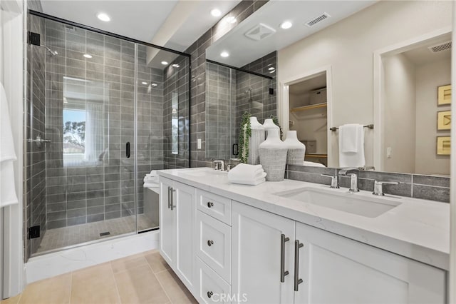 19011 Main St Unit 121, Huntington Beach, CA 92648 - full bathroom featuring a shower stall, double vanity, a sink, and visible vents