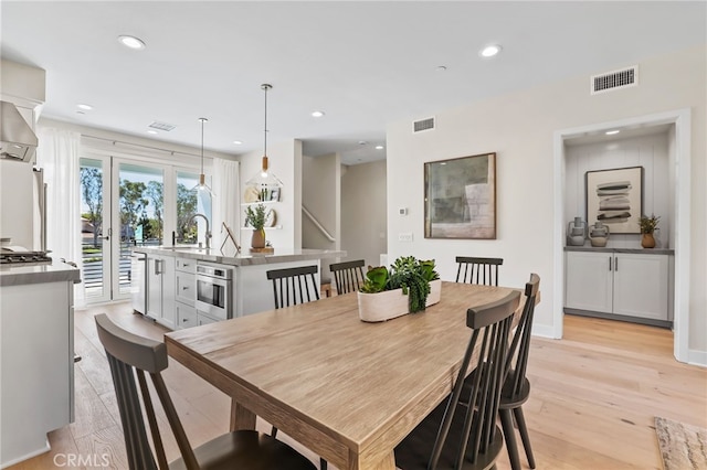 19011 Main St Unit 121, Huntington Beach, CA 92648 - dining area featuring french doors, visible vents, light wood-type flooring, and recessed lighting