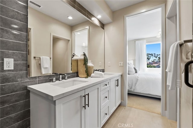 19011 Main St Unit 121, Huntington Beach, CA 92648 - ensuite bathroom featuring visible vents, a sink, double vanity, ensuite bath, and tile patterned flooring