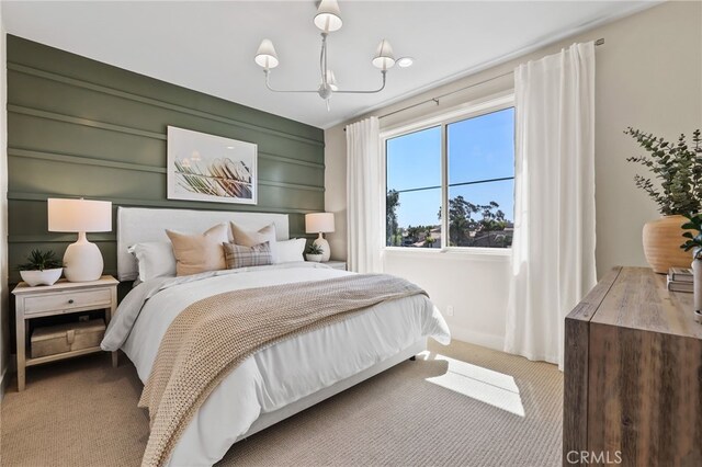 19011 Main St Unit 121, Huntington Beach, CA 92648 - carpeted bedroom with an inviting chandelier