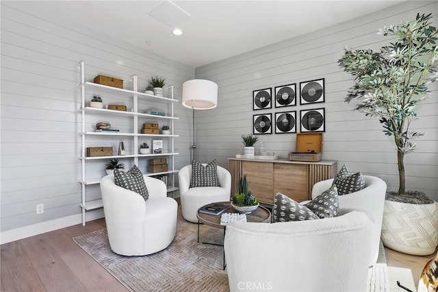 19011 Main St Unit 121, Huntington Beach, CA 92648 - sitting room featuring baseboards and wood finished floors