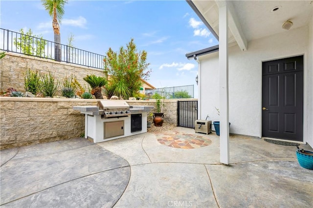 view of patio with a grill, area for grilling, and fence