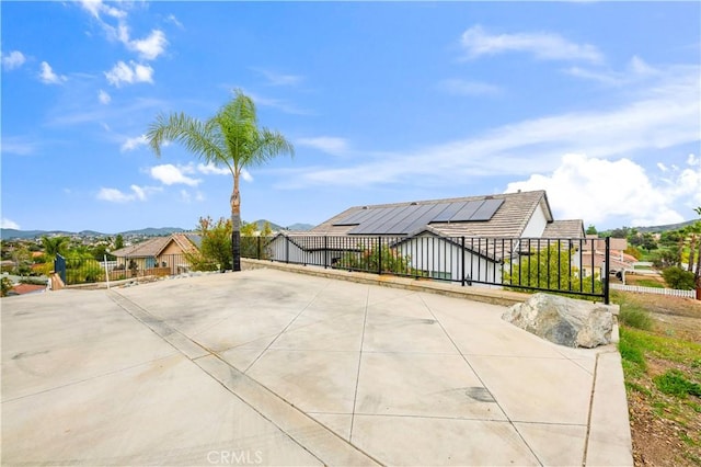 view of patio with a gate and a fenced front yard
