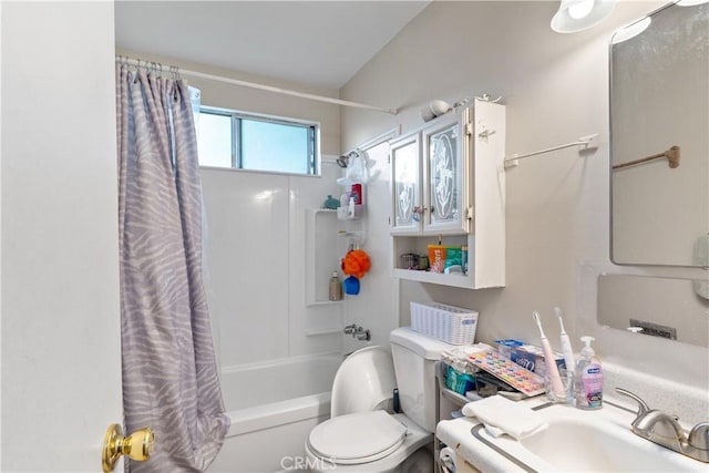 full bathroom with toilet, shower / tub combo with curtain, and a sink