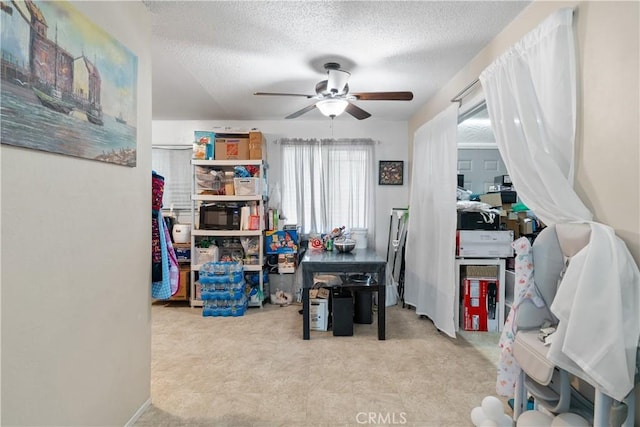 office area featuring a textured ceiling and a ceiling fan