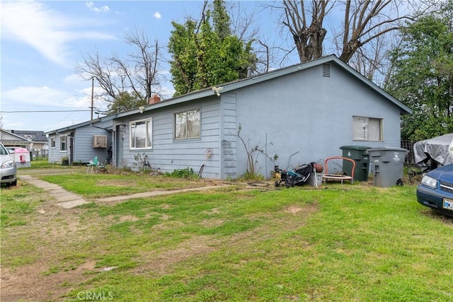 view of home's exterior featuring a yard