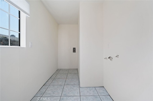 corridor with light tile patterned floors