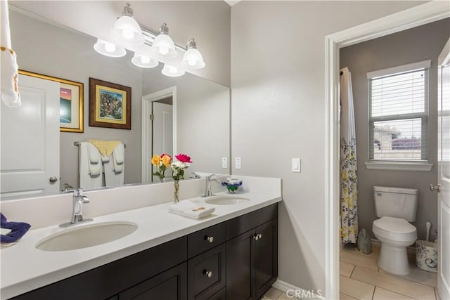 32529 Presidio Hills Ln, Winchester, CA 92596 - full bathroom with toilet, double vanity, baseboards, and tile patterned flooring