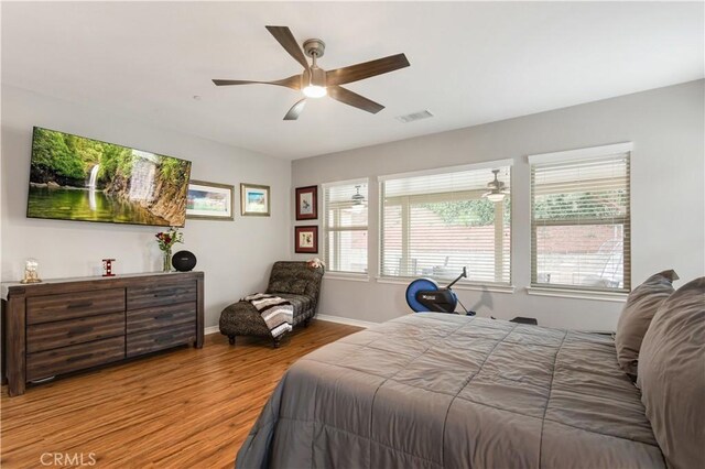 32529 Presidio Hills Ln, Winchester, CA 92596 - bedroom with wood finished floors, baseboards, and a ceiling fan