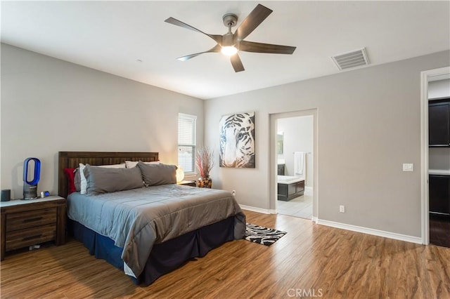 32529 Presidio Hills Ln, Winchester, CA 92596 - bedroom featuring wood finished floors, baseboards, a ceiling fan, and ensuite bath