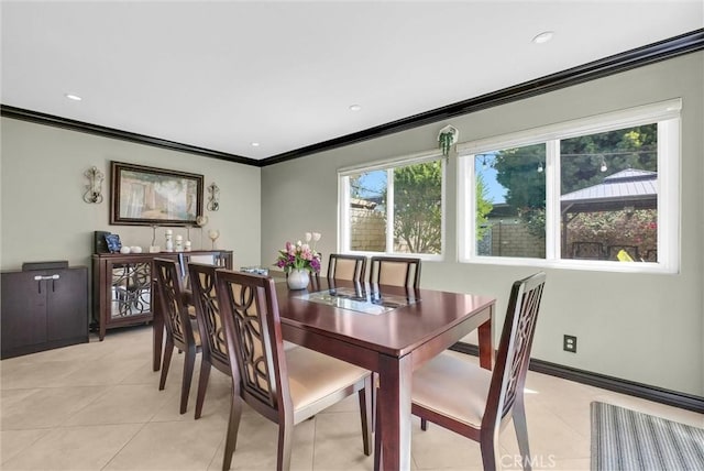 dining area featuring recessed lighting, ornamental molding, and light tile patterned floors