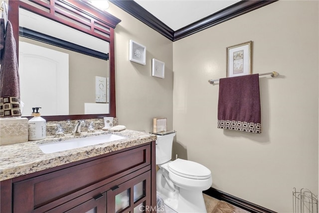 half bathroom featuring vanity, ornamental molding, tile patterned floors, and toilet