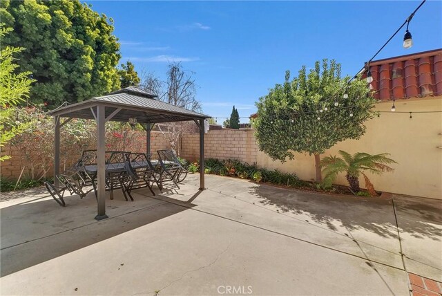 view of patio / terrace featuring a gazebo and a fenced backyard