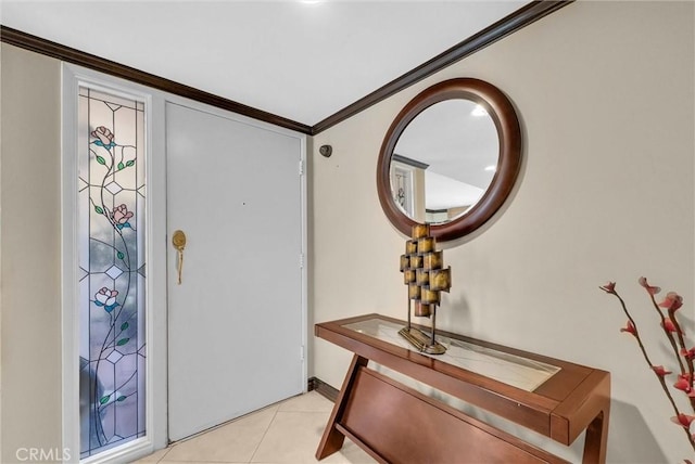 foyer with ornamental molding and light tile patterned flooring