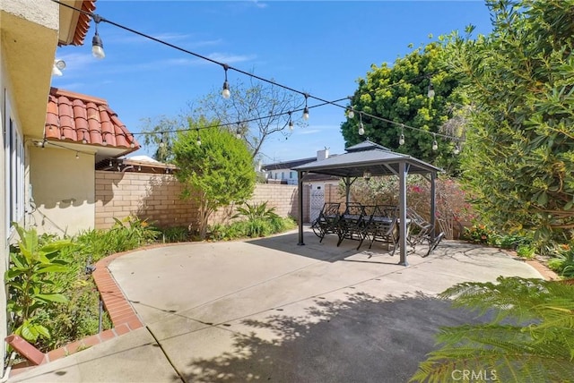 view of patio / terrace featuring a gazebo and fence