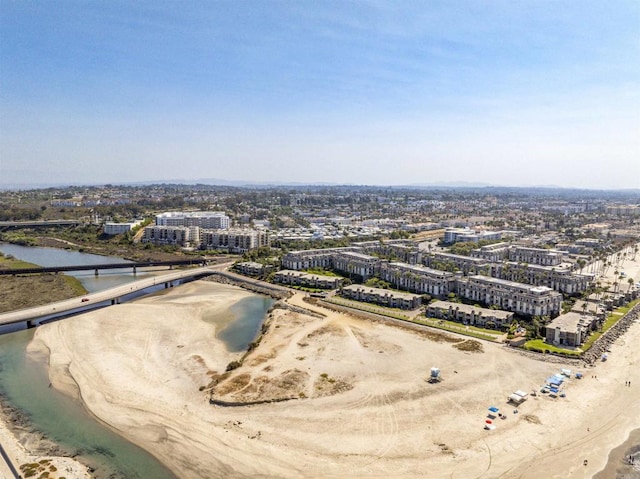 drone / aerial view featuring a view of city and a water view