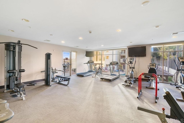 gym featuring carpet, a healthy amount of sunlight, recessed lighting, and visible vents