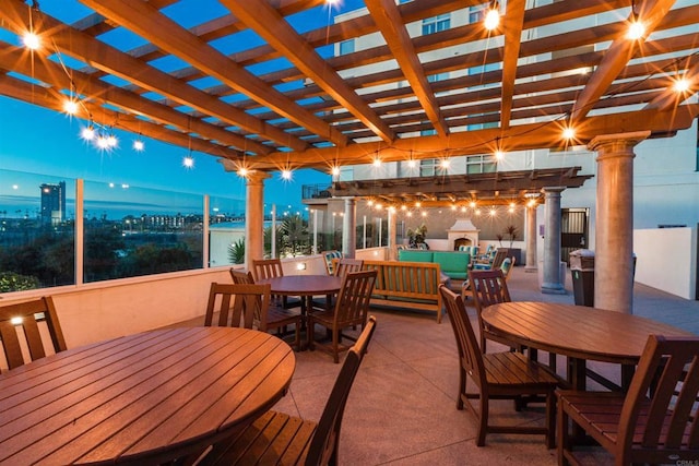 view of patio with outdoor dining space, a pergola, and an outdoor hangout area
